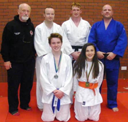Medallists David Kennedy and Caitlin McMahon with Club Coaches along with senior participants at the Northern Ireland Open