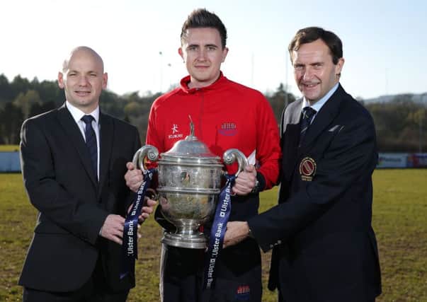 Waringstown captain Lee Nelson with the Ulster Bank Northern Cricket Union Premier League Cup which the club hopes to retain this season.  Also in the picture are Sean Murphy, regional managing director Ulster Bank, and Peter McMorran, president of the NCU.