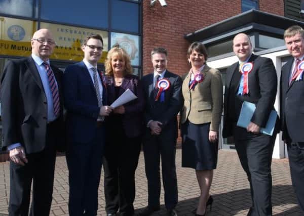 First Minister Arlene Foster accompanied local DUP candidates as they handed in their nomination papers for the forthcoming Assembly elections to Rae Kirk at Ballymena Area Electoral Office. L-R, Cllr Hubert Nicholl (Election Officer), Phillip Logan, Rae Kirk, Paul Frew, FM Foster, David McIlveen, Mervyn Storey. INBT 14-102JC