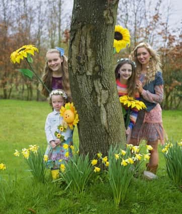 Picured are Lauryn Moore  Lilli-Belle and her mum Lisa Mills and Eden Haycock  Offering a unique, family-friendly feature at this years festival, Sunflowerfest organisers have teamed up with Magnus Vikings, RSPB and the Big Lunch NI and will be embracing the NI Year of Food & Drink celebrating the August theme Love NI Meat with local chefs, bakers and producers tempting taste-buds with cooking demonstrations, barbeques, and speciality tastings in the festivals Village Tent. Guests can enjoy this communal space with its programme of poetry, talks and demonstrations, food, fun and friendship. Children can also look forward to a range of entertaining arts and crafts, nature-focused exhibits and interactive performances as well as a family-friendly atmosphere throughout Tubbys Farm, Hillsborough, including ?a choice of designated family camping grounds.  Weekend tickets are currently priced from ?59.50 per adult and each adult ticket admits 2 children aged 15 and younger free. Day tickets to be released once l