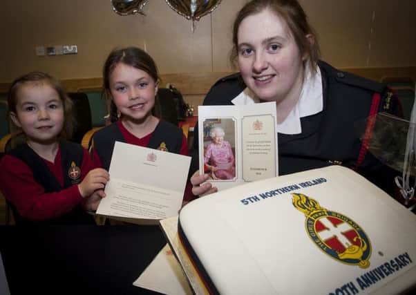 LETTER FROM QUEEN!. . . .GB Leader Janette Connor pictured with the Letter from the Queen during Friday night's Girls Brigade 5th NI Coy. 90th Anniversary at Clooney Hall Methodist Church. Included are Explorers Abbie McNally and Zoe Kitson. INLS1615MC012
