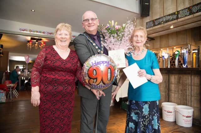 The Mayor of Mid and East Antrim Borough Council, Councillor Billy Ashe, celebrates with Glenys Holtom (right) on her 90th birthday in Carrickfergus,  included is Joan Armstrong of Senior Moments. INCT 17-708-CON