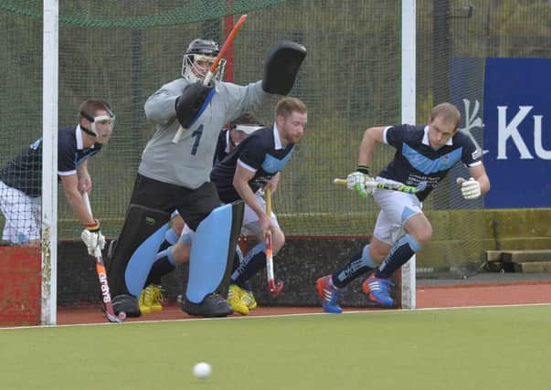 Lisnagarvey defend against Pembroke during the IHL season. Pic by Rowland White/Presseye