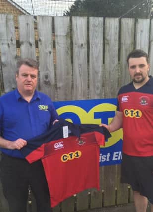 Gavin Cairns from C-Tec Belfast presenting a shirt to Craig Lewis Derriaghy captain.