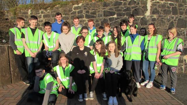Cullybackey Army Cadets are joined by Ballymena Air Cadets for the litterpick and tidy up of the Riverside Path. Included is Dusty the dog. (Submitted Picture).