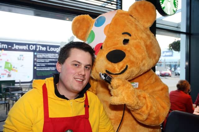 Steve Caldwell, from Starbucks at Junction One, pictured with Pudsey prior to having his head shaved to raise money for Children in Need last year.  Steve will be having his legs waxed at a charity event in the store on Monday, May 2, which will raise funds for the NI Hospice.