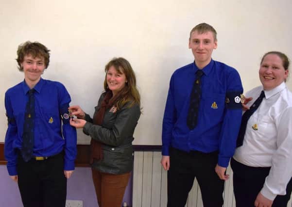 Third Ballymena Boys' Brigade recently held their annual parents' evening.  Pictured at the event are Jude White, receiving his Queen's Badge from his mum Catherine White, and Lee Dempster, receiving his Queen's Badge from his mum Julia Dempster.