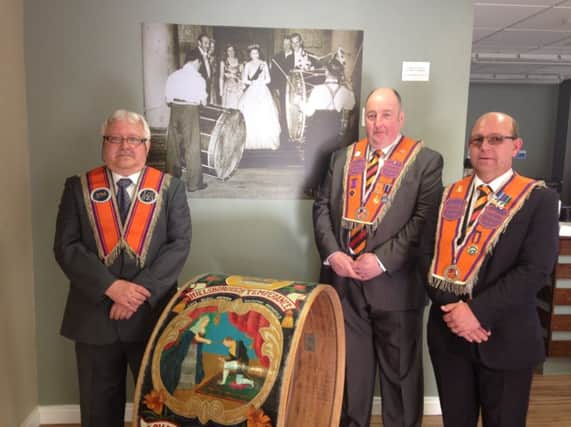 (L-R) Sandy Heasley, Past Master LOL 823; Robert Mitchell, Hillsborough District Master and Philip Nelson, Deputy District Master pictured with one of the Lambeg drums which was played to Her Majesty and Prince Philip at Hillsborough Castle