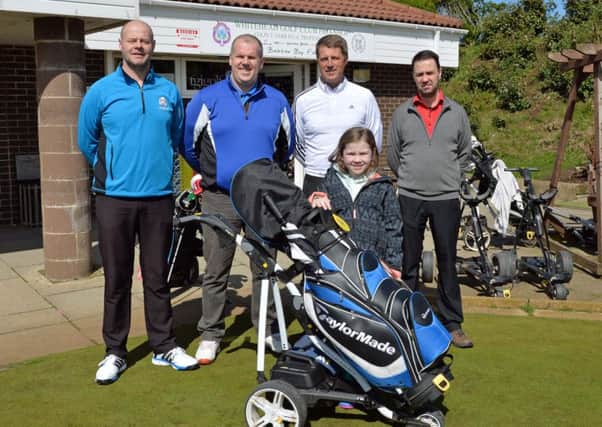 Whitehead Golf Club professional, Colin Farr (2nd right) is pictured with Glenn Baxter (left) who organised a charity golf challenge to play 72 holes at the club on Monday 20 June with Alan Gibb, Stephen McNeice and Nicholas McClay (not pictured) all funds raised will go to Macmillan Cancer Support in memory of Glenn`s late father also pictured is Glenn`s daughter, Caitlin. INCT 15-011-PSB