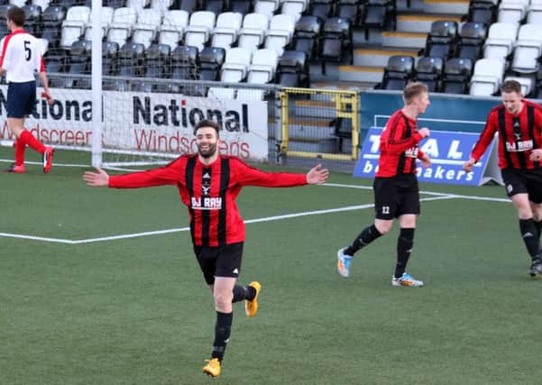 Darren Campbell celebrates after scoring Harryville Homers' opening goal in their Toals County Antrim Junior Shield final win over Ballyvea. Picture: John McIlwaine.