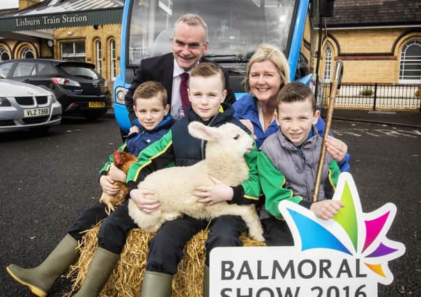 Brothers L-R Sam, Eddie & Matthew Mercer travel with Ruby the Hen and Louie the lamb to announce Translinks special bus, coach and train transport plans for this years Balmoral Show, May 11 - 13.