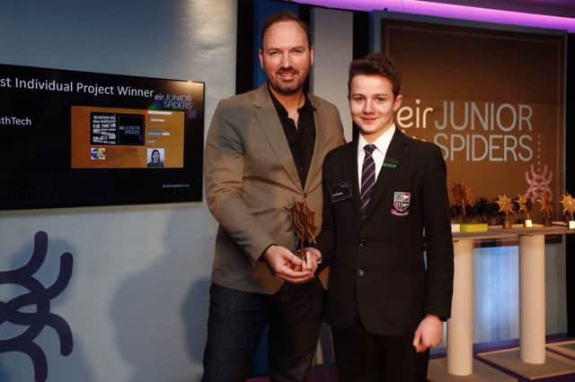 New-Bridge pupil Jack Delaney being presented with an eir Junior Spiders award