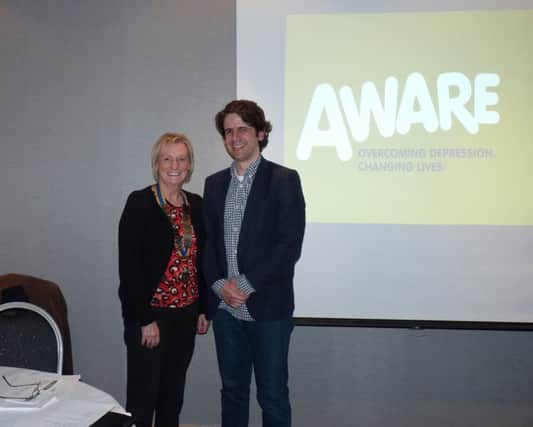 Kieran Hughes of AWARE with Brenda Houston, president of Carrickfergus Rotary Club. INCT 18-754-CON