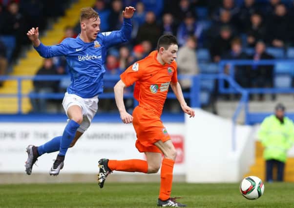 Glenavon's Mark Sykes with Linfield's Stephen Fallon during Saturday's Danske Bank Premiership game at Mourneview Park.