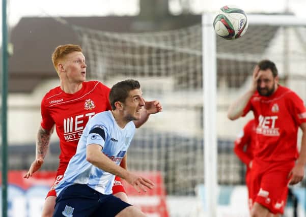 Ballymena United's Gary Thompson and Portadown's Chris Casement compete for an aerial challenge during today's Danske Bank Premiership game at the Showgrounds. Picture: Press Eye.