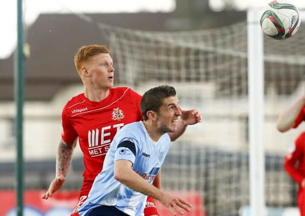 Ballymena United's Gary Thompson and Portadown's Chris Casement compete for an aerial challenge during the Danske Bank Premiership game at the Showgrounds. Picture: Press Eye.