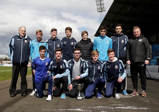 Ballymena United under-17s celebrate their league title success at the Showgrounds on Saturday. Included is club chairman John Taggart. Picture: Damian McKee (Picture Magic Studio)