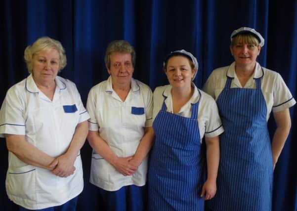 Mrs Turkington who has retired as Unit Catering Supervisor (head cook) at Parkhall PS following 28 years service to the school pictured with her colleagues.
