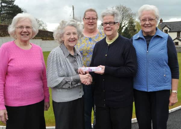 President of the Ballymena Festival Irene Cummings (2nd left) makes a presentation to Isobel Petticrew who is retiring as Cup Secretary of the festival after 12 years service. Included are  Joyce Coulter, Vice Chairman; Caroline Collie and Dorothy Collie, Vocal Secretary. INBT 19-100JC