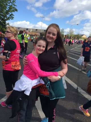 11-year-old Kelly O'Rourke celebrates after taking part in the Belfast Marathon. inbm19-16s