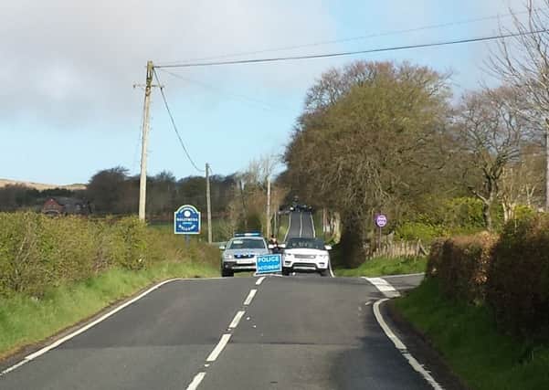 Police officers have cordoned off the scene of Monday evening's fatal RTC on the Collin Road near Ballyclare. INNT 18-503CON