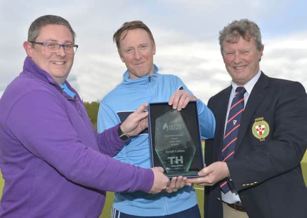 Winner Errol Lutton of Lisnagarvey Hockey Club with Steven McMurray of Total Hockey (Sponsors) and President of Ulster Hockey, Davy Larmour. Pic by Rowland White / PressEye