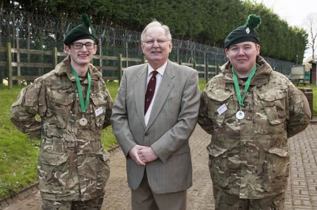 Celebrating their success with Colonel David McCleery OBE, Chairman Army Cadet Force Association (NI) are (left) Cadet Corporal Martin Wilson and (right) Cadet Corporal Scott Simpson. Credit: Robbie Hodgson
