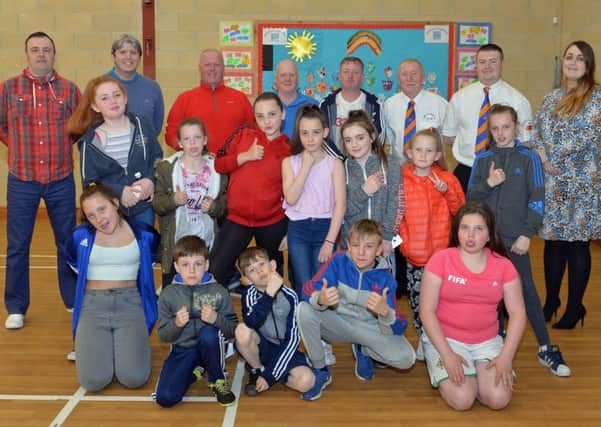 Project officer Claire Crawford (right) is pictured with committee members from Sunnylands and Woodburn Community Development Group and children who completed the cultural diversity programme.  INCT 16-006-PSB