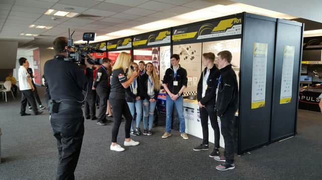 The Carrickfergus Grammar School team being interviewed at the F1 Technology Challenge. INCT 19-701-CON