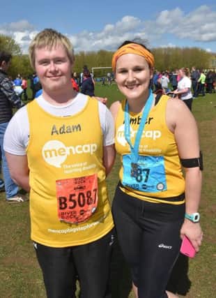 Pictured at the finish line of the 2016 Deep RiverRock Belfast City Marathon is Amber Getty of Ballymoney with her cousin Adam Martin. Amber completed the full 26.2 miles-her first marathon - in aid of Mencap, a charity that supports children and young people with a learning disability and their families. INBM20-16S
