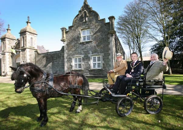 Edwin Dash takes the reins for Jake the pony and, pictured on board the trap, are Councillor Thomas Hogg, Mayor of Antrim and Newtownabbey and Albert Titterington from Great Game Fairs of Ireland.