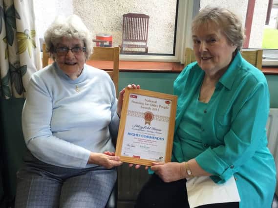 Jean Archibald and Naomi Bradshaw, residents of Abbeyfield House Carrickfergus, celebrating after the location was highly commended in the National Housing for Older People Awards. INCT 18-798-CON