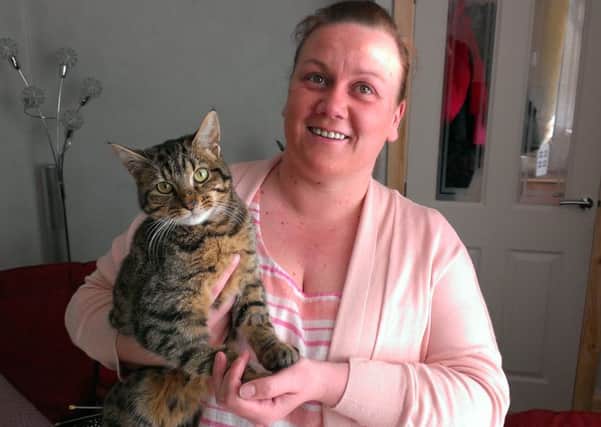 Alanna McIlwaine is glad to have her beloved cat Pebbles back home with her. INNT 19-504CON