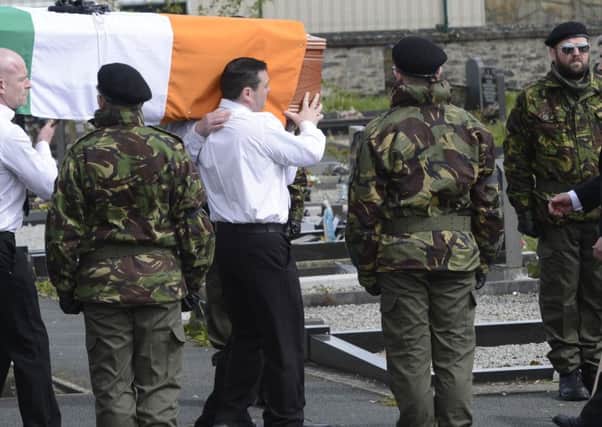 A guard of honour flanks the coffin of Michael Barr at his funeral in Strabane Co Tyrone this morning.