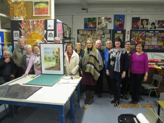 Members of the Antrim Art Club at the demo on framing by Exhibition Co-ordinator Jamie Crabbe.
