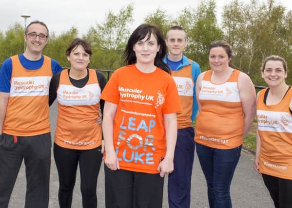 Claire O'Hanlon (front centre) with her #TeamLeapforLuke runners who competed in the Belfast Marathon in aid of Muscular Dystrophy UK. Photo by Oliver Corr