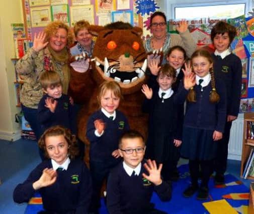 Rathlin residents received a special visit from the Gruffalo recently. His first island appearance was in St Marys Primary School where eight very surprised pupils gave him a warm and enthusiastic welcome. He seemed to be as big a hit with the teaching staff as with the children. INBM2016S