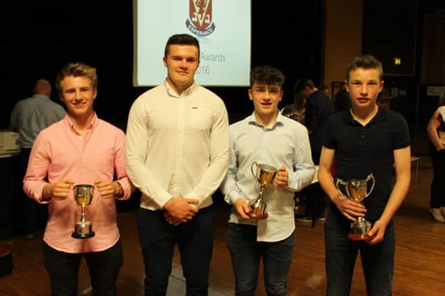 Rugby prize winners Jonny Stewart, Joel Dundas and Rueben Crothers pictured with Ulster Rugby's Jacob Stockdale at the annual Wallace High School Sports Dinner.