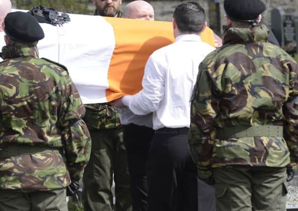 A guard of honour flanks the coffin of Michael Barr at his funeral in Strabane Co Tyrone
