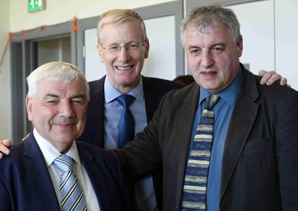 Gregory Campbell (centre), DUP MP for East Londonderry, with successful candidates George Robinson and Maurice Bradley