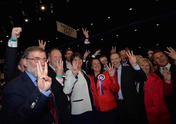 DUP leader Arlene Foster celebrates with candidates and supporters after the party retained its three seats in North Belfast. Pic Colm Lenaghan, Pacemaker