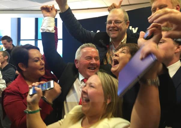 Richie McPhillips celebrates the news he took one of Sinn Fein's seats