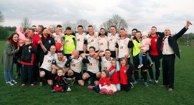 Ruby's Rovers FC celebrate after winning the Sammy Moore Memorial Cup after beating Carniny Amateurs & Youth on Friday night at Clough. INBT 20-826H