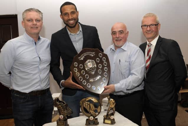 On behalf of Banbridge Town Supporters Club, Chairman Terry Sweeney presented Tuda Murphy with  the Players' Player of the Year award and the Player of the Year award, the Jimmy Vage Memorial Shield, which was won jointly with Stephen Greene, included is Manager Ryan Watson and Chairman Dominic Downey. INBL1619-226EB