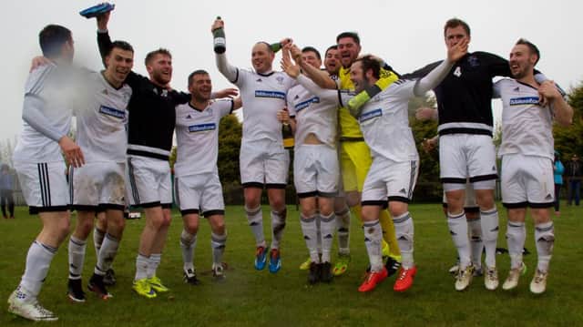 Rathfriland Rangers celebrate winning a first league title in 18 years after their 0-6 victory away to Larne Tech Old Boys. Photos: Iain McDowell / Rathfriland FC