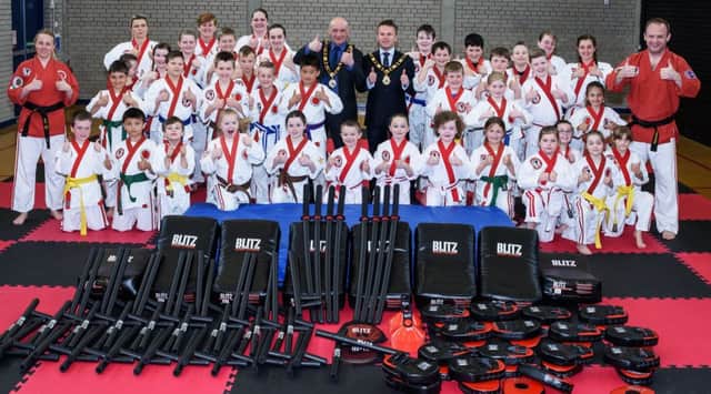 Students, Coaches and Volunteer Assistants from Shogun Ju-Jitsu International Ireland Clubs giving the Thumbs Up to A&NBC Funding Awards. Pictured with Mayor Thomas Hogg and Deputy Mayor John Blair.