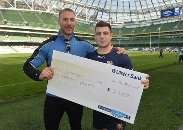 Ulster Bank Rugby Ambassador Stephen Ferris presents Banbridge RFC full back Adam Doherty (right) with the Â£2.5K prize for his club at Sunday's Ulster Bank 'Drop-Kick for your Club' event at the Aviva Stadium in Dublin.
