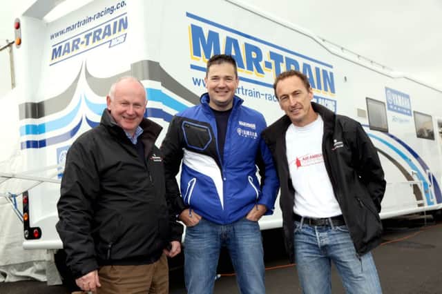 PACEMAKER, BELFAST, 8/5/2016: Mar-Train Yamaha's Tim Martin announces that MotoGP legend Jeremy McWilliams is to replace the injured Dan Kneen in the Saintfield based team at the Vauxhall International North West 200 as Event Director, Mervyn Whyte looks on.
PICTURE BY STEPHEN DAVISON