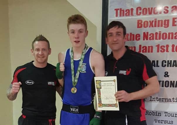 Ethan McGuckin along with his coaches Fred hampsey and chalky Kelly,