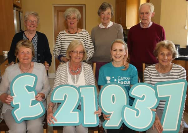 Treasurer of the Ballymena Support Group of Cancer Focus Northern Ireland Vivian Pundyke who handed over a cheque for Â£21,937 to Cancer Focus N.I.Community Fundraising Manager Suzi McIlwain at the group's AGM in Broughshane.   Back row, L-R, Ena McKeague, Jean Kennedy, Iris Hamilton, Jim Birdy. Front, L-R, Rosemary Kennedy (chairperson), Vivian Pundyke, Suzi McIlwain and Enid Millar. INBT 20-102JC
